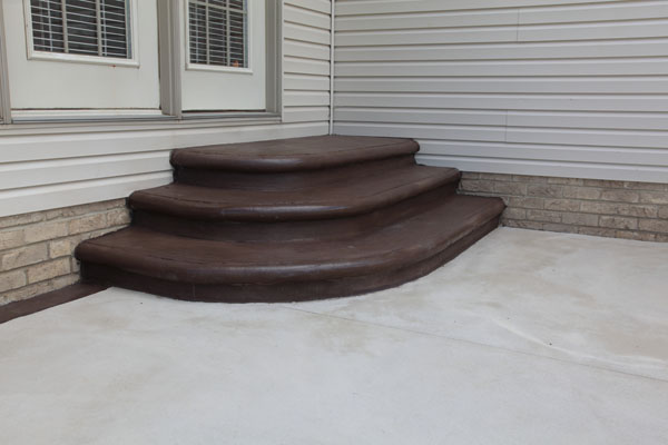 Chocolate Colored Concrete Steps to Match Patio Border